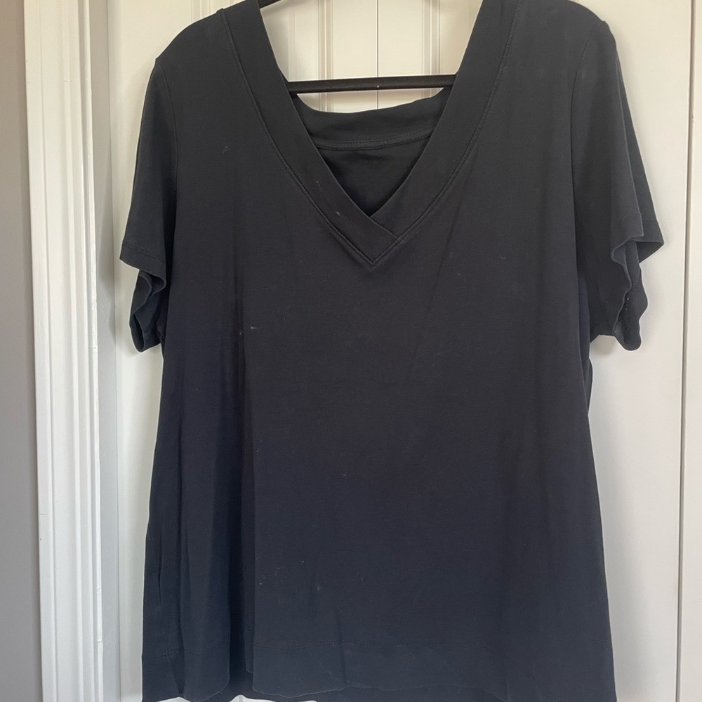 Woman’s black v-neck tee